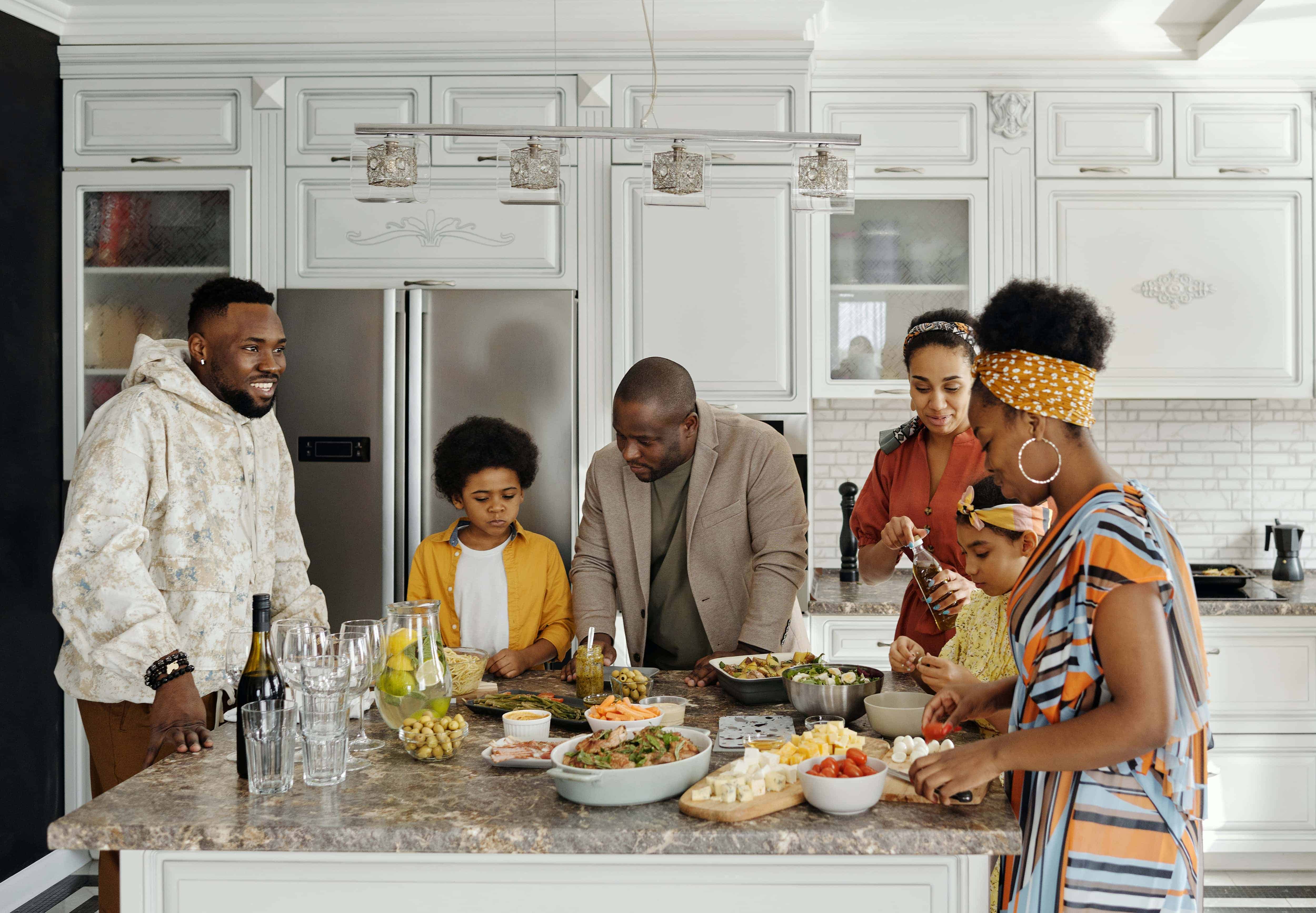 Family in front of fridge. - via fridge.com