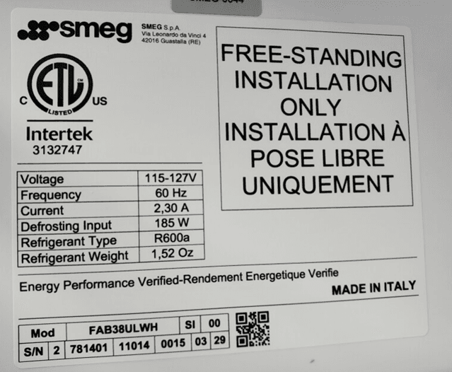 "Made in Italy", the model, and serial numbers are printed on a white label inside of the refrigerator's top door