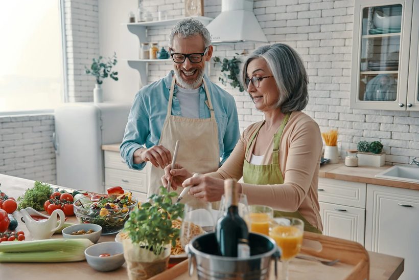 Couple cooking dinner together in their upgraded kitchen