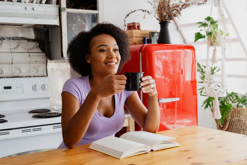Morning coffee beside a red retro refrigerator