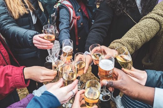 Friends toasting with cold drinks