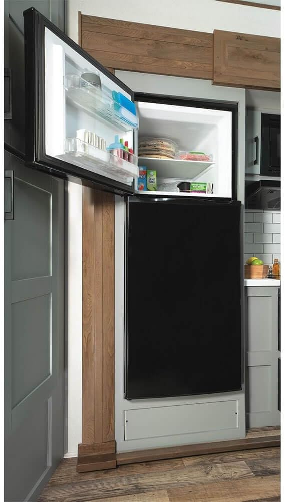 GE GPV10FGNBB 24" Top Freezer Refrigerator with 9.93 cu. ft. Capacity 12V DC Power Only LED Lighting and Adjustable Spillproof Glass Shelves in Black | Fridge.com